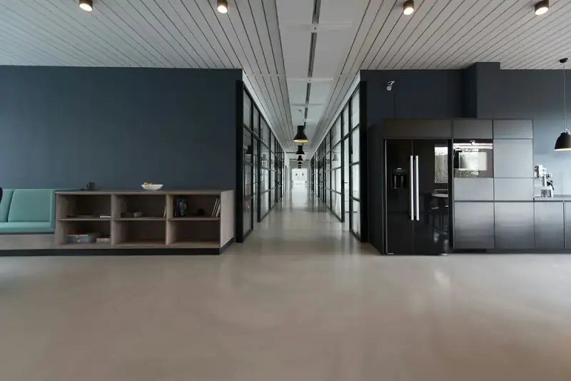 Modern office interior with a long corridor and polished floor